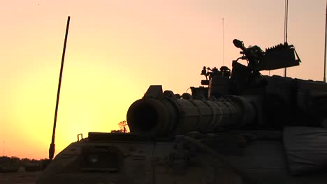 An-Israeli-tank-is-silhouetted-against-a-multi-colored-sky