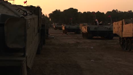 A-line-of-Israeli-army-vehicles-are-parked-along-the-Israel--Gaza-Strip-border