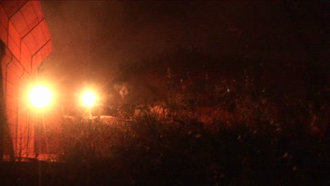 An-Israeli-army-tank-patrols-along-the-border-wall-at-night