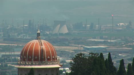 Power-plants-and-the-Baha'i-temple-dome-are-seen-on-the-skyline-of-Haifa-Israel