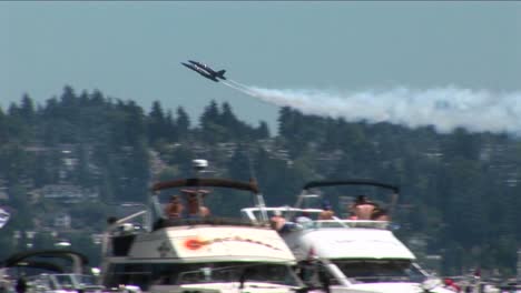Blue-Angels-jets-fly-over-crowds-of-people-and-boats