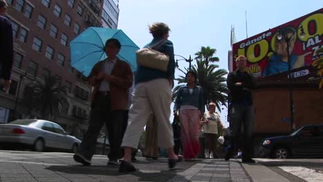 Pedestrians-cross-a-street-at-an-intersection