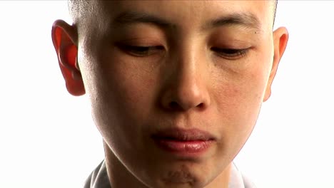 A-young-Buddhist-monk-prays-1
