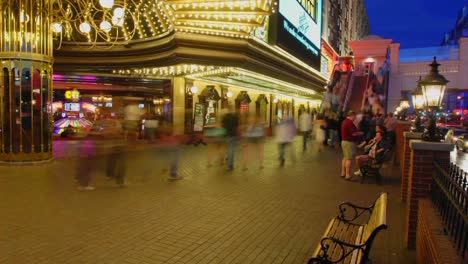 A-time-lapse-at-night-of-people-sitting-and-walking-in-Las-Vegas