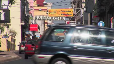 Argentina-town-with-cars-and-businesses-with-signs-in-Spanish-close-up