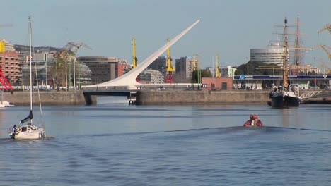 Buenos-Aires-harbor-with-sail-boat-and-bridge-Puerto-Madero