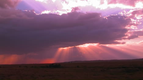 Beautiful-sun-beams-burst-forth-from-dark-clouds-onto-open-plains