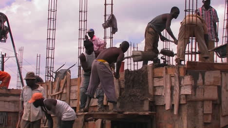 Workers-transport-building-materials-from-the-ground-to-the-roof