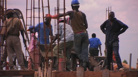 A-crew-of-men-work-on-constructing-a-building