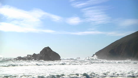 Waves-roll-into-shore-on-a-sunny-day-along-California-coastline