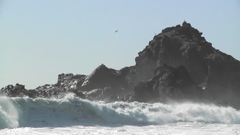 Waves-roll-into-shore-on-a-sunny-day-along-California-coastline-1