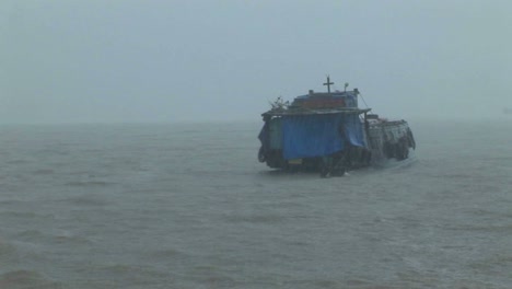A-dilapidated-vessel-heads-out-into-a-heavy-storm