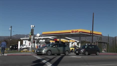 A-time-lapse-shot-of-a-gas-station-as-traffic-moves-quickly-by