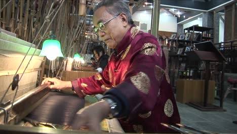 Chinese-workers-weave-on-a-hand-loom-with-great-speed-and-accuracy