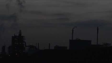 A-time-lapse-shot-from-night-to-day-of-a-petrochemical-factory-or-oil-refinery