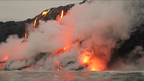 Spectacular-dusk-lava-flow-from-a-volcano-into-ocean