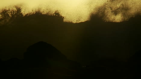 Large-waves-as-they-crest-and-break-in-slow-motion-at-sunset-1