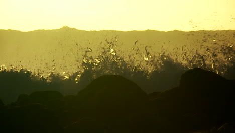 Large-waves-as-they-crest-and-break-in-slow-motion-at-sunset-3