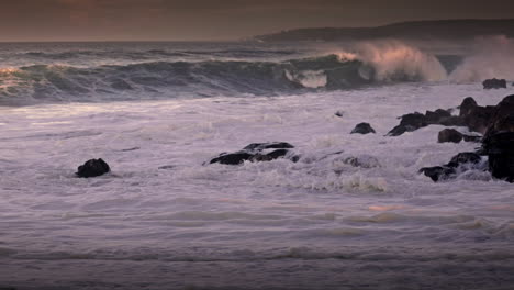 Waves-roll-into-a-beach-following-a-big-storm-in-slow-motion-4