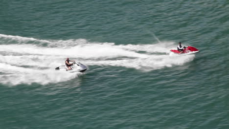 Two-jet-skis-race-across-the-water