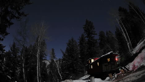 Time-lapse-of-night-sky-above-a-train-caboose-at-Strawberry-Hot-Springs-Colorado