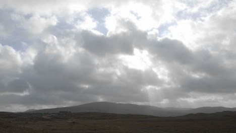 Time-lapse-of-clouds-and-sun-flares-over-peat-bogs-at-Croagleheen-Ireland