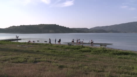 Time-lapse-of-eight-person-rowing-sweep-entering-the-water-on-Lake-Casitas-in-Oak-View-California