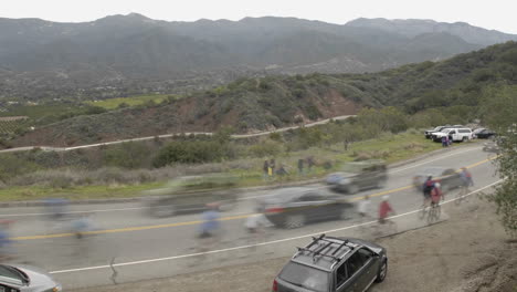 Peloton-in-slow-motion-during-a-time-lapse-of-the-2008-Tour-of-California-bike-race-passing-over-Dennison-Grade-in-Ojai-California