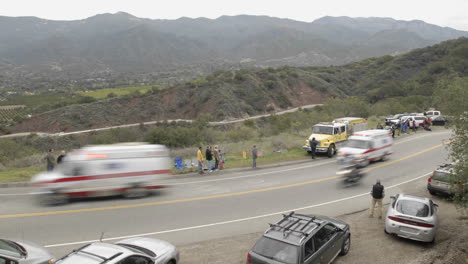 Peloton-passing-in-a-time-lapse-of-the-2008-Tour-of-California-bike-race-passing-over-Dennison-Grade-in-Ojai-California
