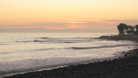 Time-lapse-of-waves-and-surfers-at-Ventura-Point-at-sunset-in-Ventura-California