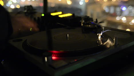 Closeup-of-a-disc-Jockey-spinning-records-and-playing-music-at-a-nightclub-in-San-Diego-California