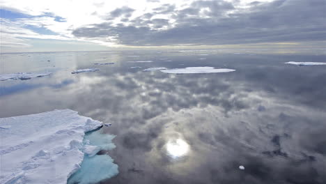Sea-ice-is-seen-in-the-Arctic-ocean-with-a-perfect-reflection-of-the-ocean