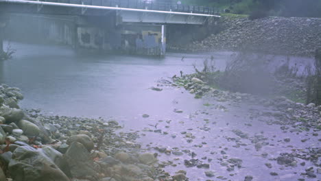 Time-lapse-of-a-bridge-flooding-as-a-winter-storm-dumps-rain-into-a-river