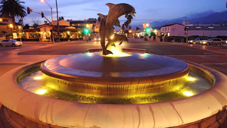 Traveling-time-lapse-shot-of-the-dolphin-fountain-near-State-Street-in-downtown-Santa-Barbara-California-1