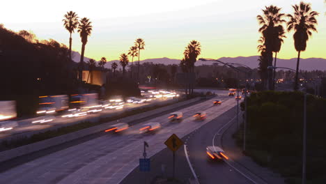 Time-lapse--cars-travel-on-a-freeway-at-sunset-or-dusk-1