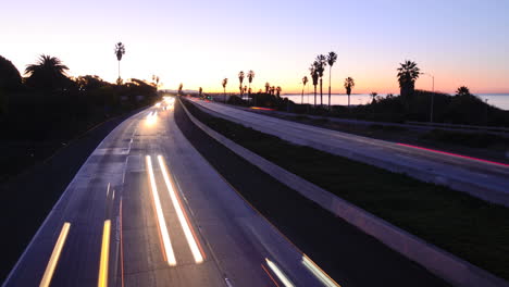 Time-lapse--cars-travel-on-a-freeway-at-sunset-or-dusk-3