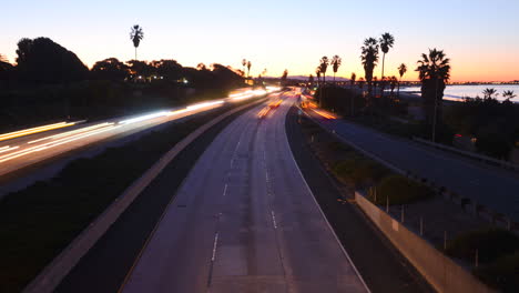 Time-lapse--cars-travel-on-a-freeway-at-sunset-or-dusk-4