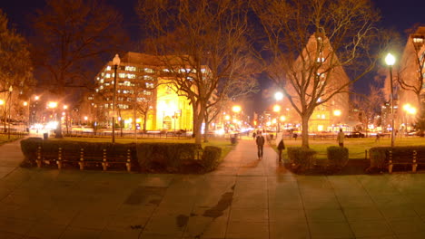 Motion-time-lapse-of-people-walking-during-rush-hour-traffic-at-dusk-in-Dupont-Circle-in-Washington-DC