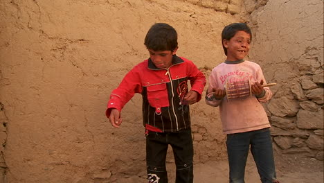 A-blind-child-and-friend-play-with-broken-kites-in-Kabul-Afghanistan
