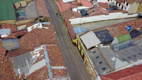 Aerial-establishing-shot-looking-down-of-a-red-tile-roofed-neighborhood-in-Bogota-Colombia