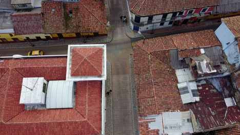 Aerial-establishing-shot-looking-down-of-a-red-tile-roofed-neighborhood-in-Bogota-Colombia-1