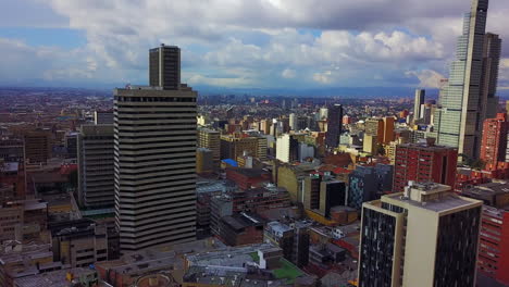Beautiful-rising-aerial-establishing-shot-of-old-buildings-modern-skyscrapers-and-neighborhoods-in-downtown-Bogota-Colombia