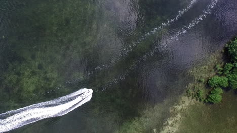 An-aerial-shot-looking-straight-down-over-a-boat-and-wake