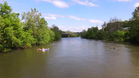 An-Excellent-Aerial-Shot-Of-Tourists-Floating-Down-The-French-Broad-River-In-Asheville-North-Carolina