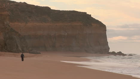 A-Person-Walks-On-The-Beach