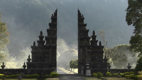 The-Fog-Drifts-By-A-Traditional-Balinese-Temple-Gate-In-Bali-Indonesia-4