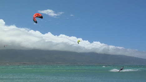 A-Wide-Shot-Of-A-Windsurfer-Against-A-Hawaiian-Landscape