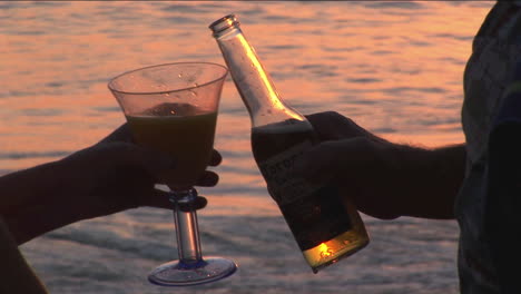 A-couple-makes-a-toast-to-the-ocean