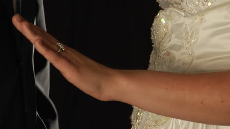 The-Groom-slips-a-ring-on-the-bride's-finger