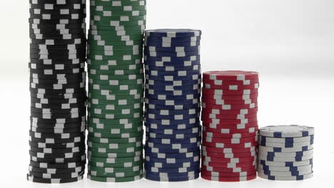 Stacks-of-poker-chips-sit-in-a-row-arranged-by-value